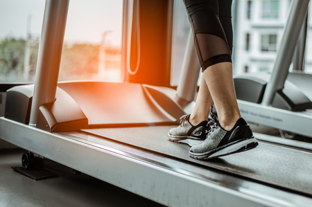 Close up on shoe,Women running in a gym on a treadmill.exercising concept.fitness and healthy lifestyleの写真素材