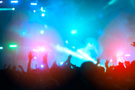 silhouettes of hand in concert.Light from the stage.の写真素材