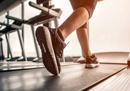 Close up on shoe,Women running in a gym on a treadmill.exercising concept.fitness and healthy lifestyle の写真素材