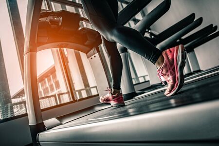 Close up on shoe,Women running in a gym on a treadmill.exercising concept.fitness and healthy lifestyle の写真素材