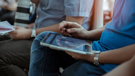 close up hands multitasking man using tablet connecting wifi. Business Project.Touching Screen...