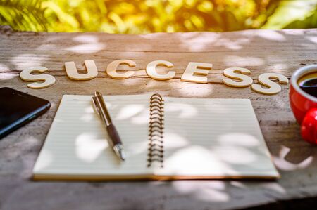 In the morning on a wooden table with wooden letters. With a wooden letter saying success.Have a notebook, Smart phone and Coffee.Meaning that Preparation for work to succeed.Preparation for work to succeed concept.
の写真素材