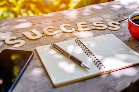 In the morning on a wooden table with wooden letters. With a wooden letter saying success.Have a notebook, Smart phone and Coffee.Meaning that Preparation for work to succeed.Preparation for work to succeed concept.
の写真素材