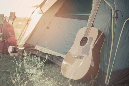 tent and guitar.adventure, travel, tourism, camping concept.の写真素材