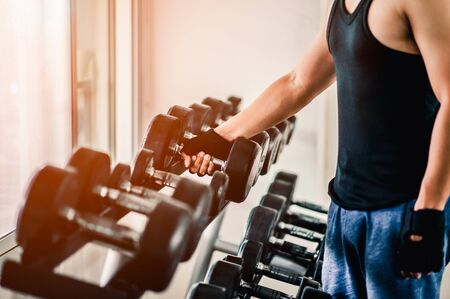 Rows of dumbbells in the gym with hign contrast and monochrome color tone.の写真素材