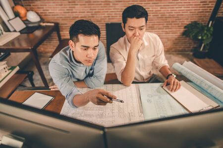 Team of engineer discussing of construction plan about the house plan the project for use in construction. Engineer, Engineering, Architecture, Design, Planning, Occupation concept.の写真素材