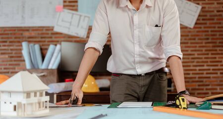 Male architect are using ideas for designing engineering or architecture to come out completely. Engineer, Engineering, Architecture, Design, Planning, Occupation concept.の写真素材