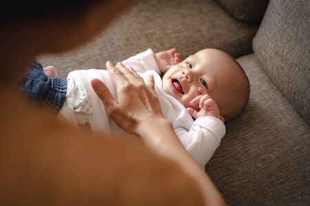 parent play with toddler in arms baby son at home in holiday. Family, father, son, baby, Happy, lifestyle concept.
の写真素材