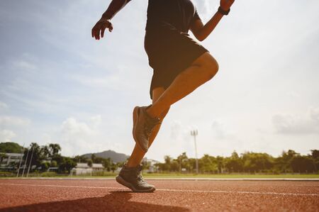 fitness, jogging, running, exercise, lifestyle and healthy concept. The young man wore all parts of...