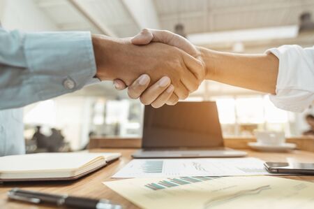 Commander handshaking new employee congratulating with starting a new job. Teamwork collaboration concept for business partners, Meetings and greetings concepts.の写真素材