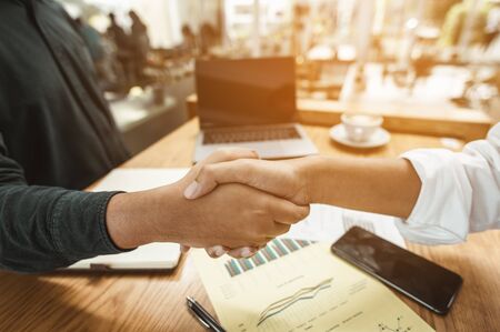 Commander handshaking new employee congratulating with starting a new job. Teamwork collaboration concept for business partners, Meetings and greetings concepts.の写真素材