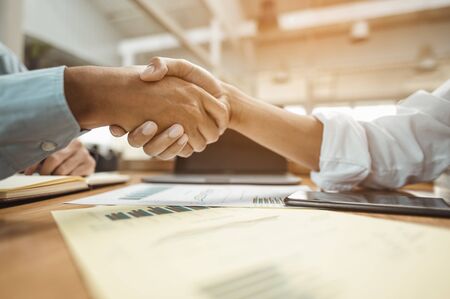 Commander handshaking new employee congratulating with starting a new job. Teamwork collaboration concept for business partners, Meetings and greetings concepts.の写真素材