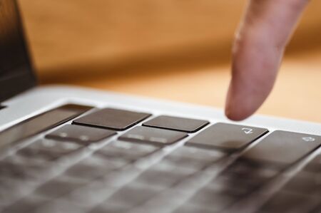 The index finger of a young businessman is about to press the enter button, indicating an agreement or business conversation at success. This is a good thing about doing new business.
の写真素材