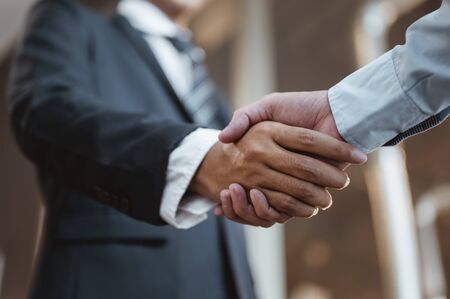Commander handshaking new employee congratulating with starting a new job. Teamwork collaboration concept for business partners, Meetings and greetings concepts.の写真素材