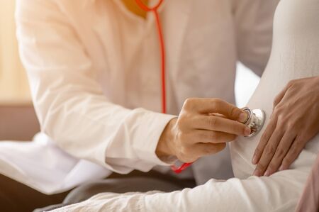 The doctor examined the symptoms of pregnant women  and her child for care and safety checks in the womb. Prenatal care and pregnancy concepts of women.の写真素材