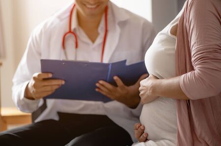 The doctor examined the symptoms of pregnant women  and her child for care and safety checks in the womb. Prenatal care and pregnancy concepts of women.の写真素材