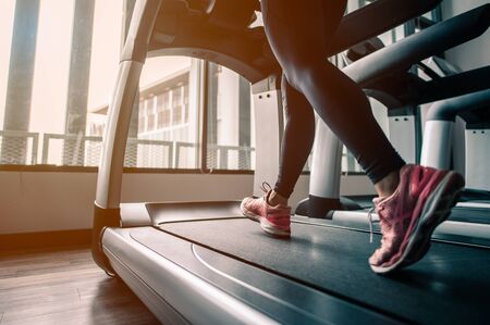 Close up on shoe,Women running in a gym on a treadmill exercising concept fitness and healthy...