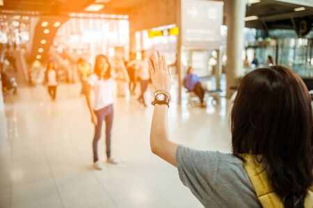 Asian girl Will be embracing friends from abroad.airports concept.airports hug.の写真素材