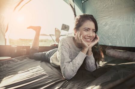 Women lie in tents.at camp.の写真素材