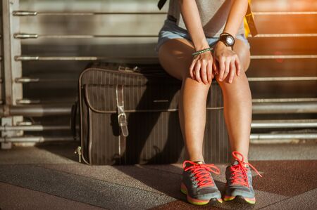 girls in at airport together, with luggage. Air travel, summer holiday, or mobile phone application の写真素材