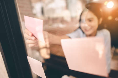 Female architect are using ideas by paste the paper for designing engineering or architecture to come out completely. Engineer, Engineering, Architecture, Design, Planning, Occupation concept.の写真素材