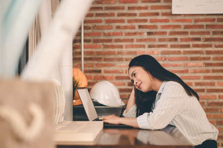 Female architect are using ideas for designing engineering or architecture to come out completely. Engineer, Engineering, Architecture, Design, Planning, Occupation concept.の写真素材