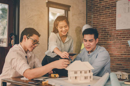 Team of engineer discussing of construction plan about the house, the project for use in construction. Engineer, Engineering, Architecture, Design, Planning, Occupation concept.の写真素材