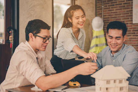 Team of engineer discussing of construction plan about the house, the project for use in construction. Engineer, Engineering, Architecture, Design, Planning, Occupation concept.の写真素材