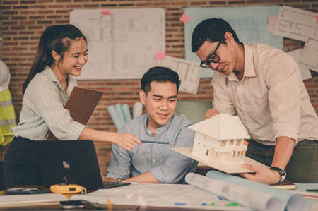 Team of engineer discussing of construction plan about the house, the project for use in construction. Engineer, Engineering, Architecture, Design, Planning, Occupation concept.の写真素材