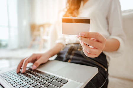 Young woman asian work from home online marketing currently ordering products for sale and delivery for customer. Business owner, SME, shipping, work from home(WFH), freelance, Start up concept.の写真素材
