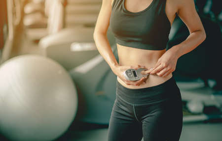 Women asia exercise to lose weight, Women who wear sportswear and exercise for diet. Workout concept. fitness, diet, gym, exercise, lifestyle and healthy concept.の写真素材