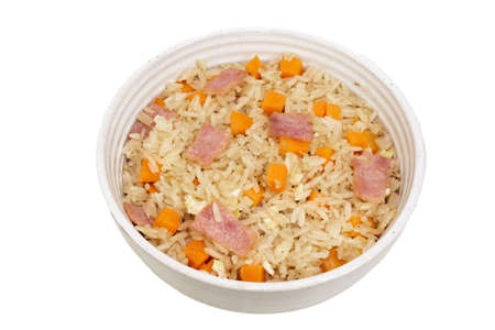 Fried rice with egg ham carrot in bowl isolated on white background close up, top view, food and drink concept.の写真素材