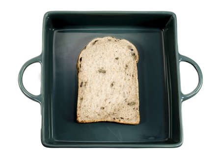 Whole wheat bread slice have rice grain in green tray isolated on white background close up, top...