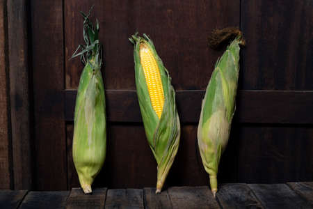 Sweetcorn on wood background, food healthy concept.