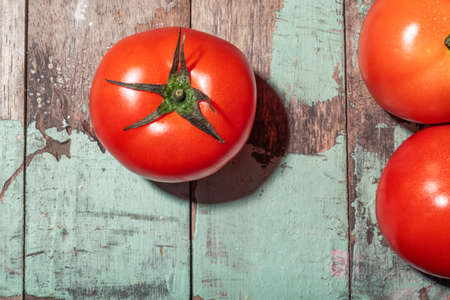 Tomato on wood background top view, healthy food concept.の写真素材