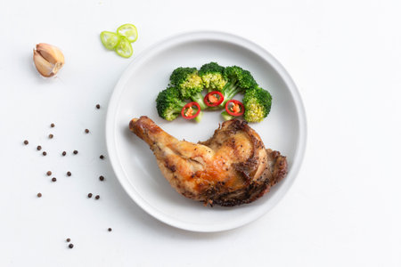 Grilled chicken has broccoli vegetable in plate on white wood background, top view, healthy food concept.の写真素材