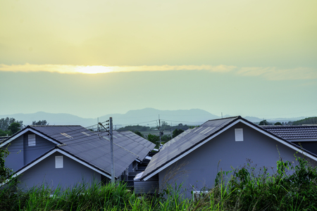 Top view roof of modern village with sunset sky, New modern town home style, Beautiful house in dawn sky, Born of new home village show of expansion of business background conceptの写真素材