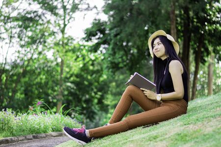 Asian women thinking and writing notes on a notebook, Attractive asian girl plan her work, Portrait...