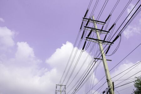 Electricity pole against blue sky clouds, Transmission line of electricity to rural, High voltage...