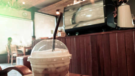 Coffee cafe restaurent in vintage tone, Flare light of morning with glass of dark coffee, Drink...