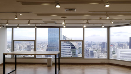 Skyscrapers in Bangkok city town through the mirror window, Cityscape view from the buildingのeditorial素材