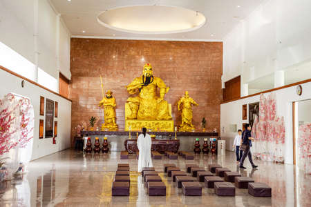 Visit the biggest temple in Batam island, Indonesia - Nov 29, 2018,  The golden god statues in the temple. The Maha Vihara Duta Maitreya Temple in Batam Islandのeditorial素材