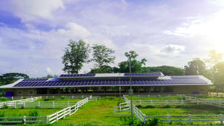 Solar cell panels technology on roof top of farm in blue sky for alternative electricity generating...