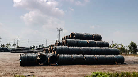Stacked of high carbon wire rod for heavy industry production,Pile of metal steel wire roll for construction site, concrete usage and building constructionの写真素材