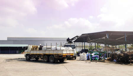 Mobile crane truck with boom lifing in heavy industry, automobile crane with hydrolic teloscopic arm for contruction siteの写真素材