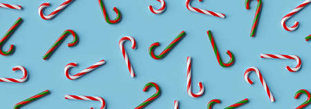 Christmas banner background of Christmas candy cane on a blue background, 3d renderingの写真素材