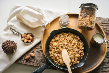 Fresh and Healthy breakfast with the grain and yogurt on the black pan close up shoot. minimal japanese styleの写真素材