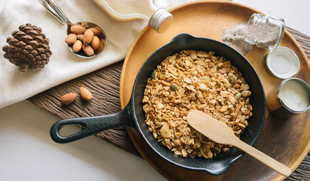 Fresh and Healthy breakfast with the grain and yogurt on the black pan close up shoot. minimal...