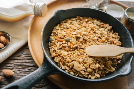 Fresh and Healthy breakfast with the grain and yogurt on the black pan close up shoot. minimal japanese styleの写真素材