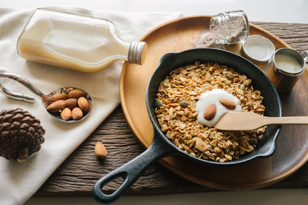 Fresh and Healthy breakfast with the grain and yogurt on the black pan close up shoot. minimal japanese styleの写真素材